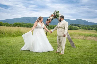 couple pose at Smoky Mountain wedding